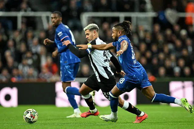 Bruno Guimaraes vies for the ball with Chelsea's French striker #18 Christopher Nkunku