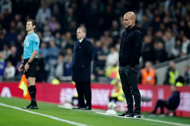 Pep Guardiola watches the players