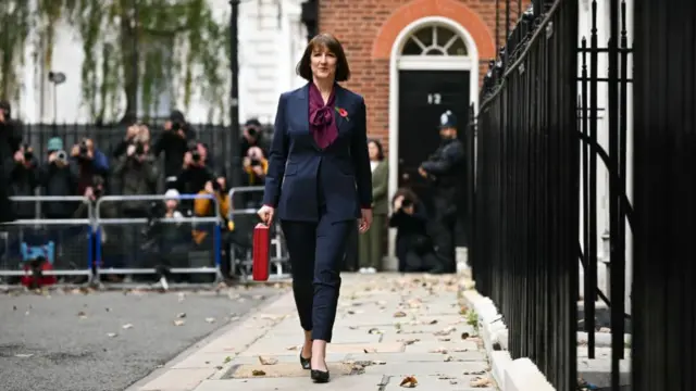 Reeves carries the red Budget Box as she leaves 11 Downing Street