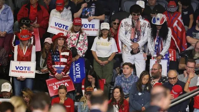 Supporters of Republican presidential nominee and former U.S. President Donald Trump pray as they attend a rally, in Henderson, Nevada,