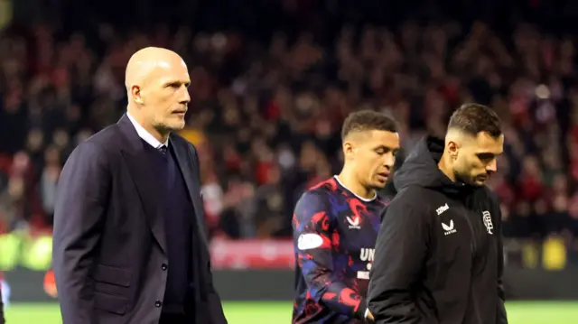 Rangers manager Philippe Clement and his players look disappointed as they leave the field after losing at Aberdeen