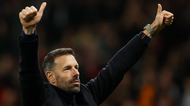 Ruud van Nistelrooy gives his thumbs up to the Manchester United fans after the team's win over Leicester