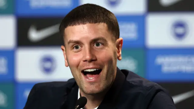 Brighton manager Fabian Hurzeler smiles during a news conference