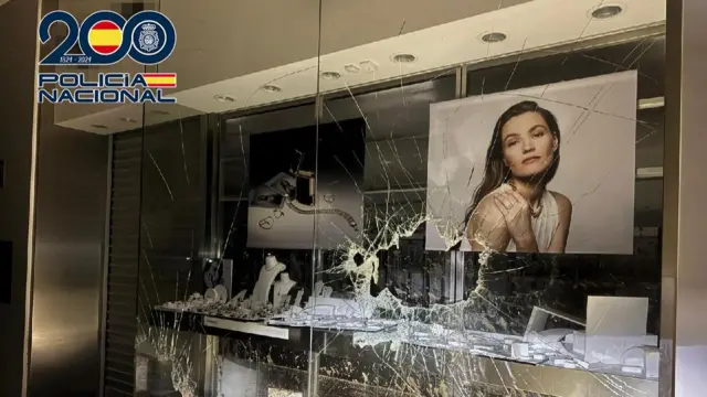 Image of a shopfront with a broken window