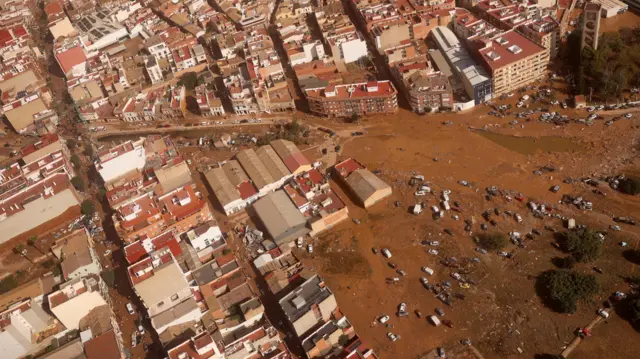 Aerial image showing flooded streets and cars