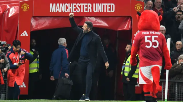 Interim Manchester United manager Ruud van Nistelrooy emerges from tunnel.