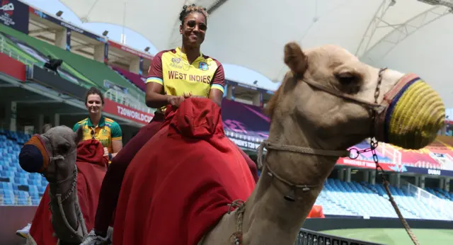 Laura Wolvaardt of South Africa and Hayley Matthews of West Indies aboard camels