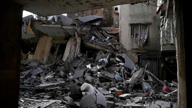 An image of the pile of rubble that has resulted from collapsed buildings