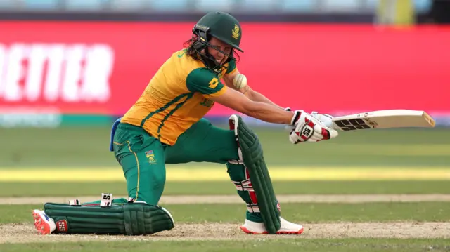 The ball strikes the helmet of Tazmin Brits of South Africa