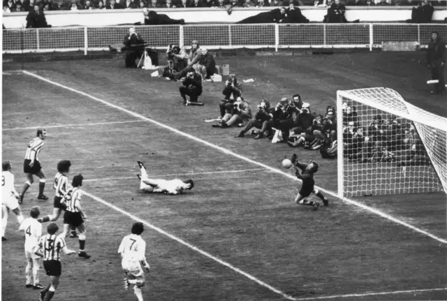 Jim Montgomery Sunderland goalkeeper completes an outstanding double save from Trevor Cherry of Leeds United