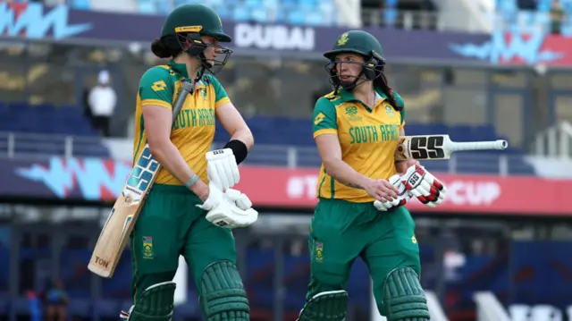 Laura Wolvaardt and Tazmin Brits of South Africa walk out to bat