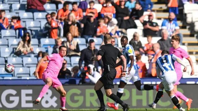 Ben Wiles gives Huddersfield the lead against Barnsley