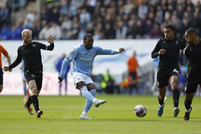 Coventry City's Haji Wright (centre) has a shot on goal