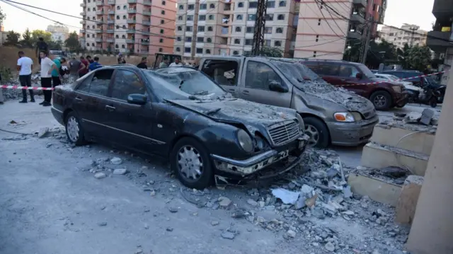 Cars covered in rubble