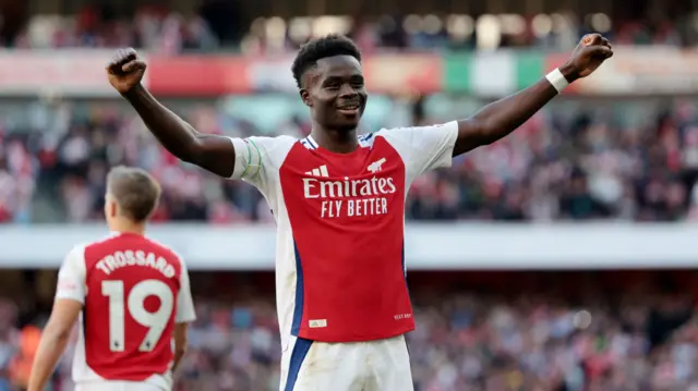 Arsenal's Bukayo Saka celebrates scoring their third goal