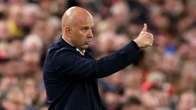 Arne Slot, Manager of Liverpool, gives a thumbs up during the UEFA Champions League 2024/25 League Phase MD2 match between Liverpool FC and Bologna FC 1909 at Anfield on October 02, 2024 in Liverpool, England.