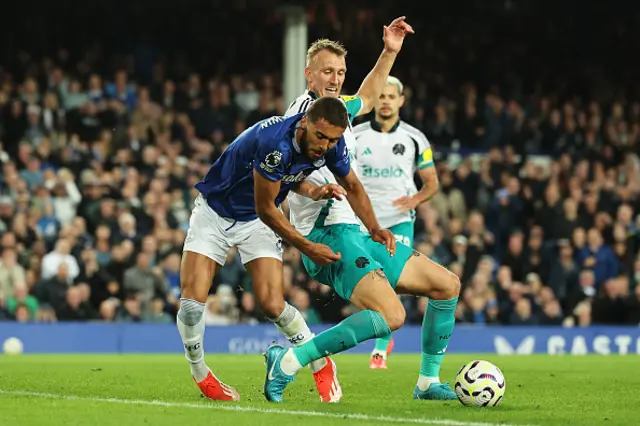 Dominic Calvert-Lewin of Everton is challenged by Dan Burn