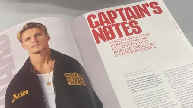 Martin Odegaard poses in the matchday programme