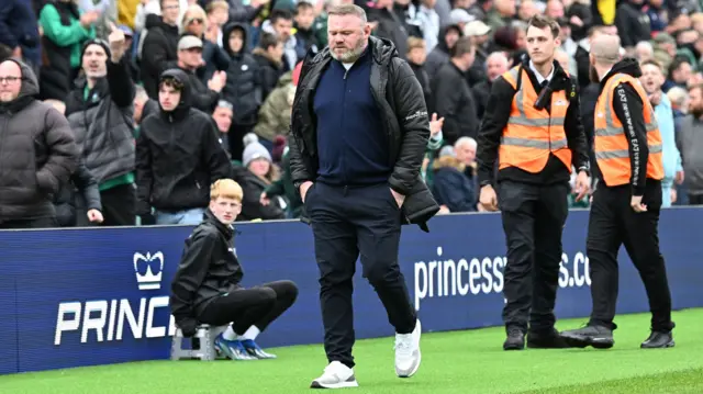 Wayne Rooney walks off after being red-carded