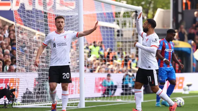 Liverpool's Diogo Jota celebrates scoring their first goal with Liverpool's Mohamed Salah