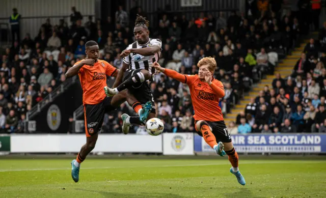 St Mirren's Toyosi Olusanya flanked by Dundee United's Emmanuel Adegboyega and Luca Stephenson