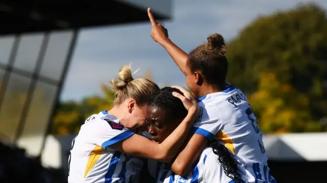 Agyemang is congratulated by teammates after scoring Brighton's fourth goal