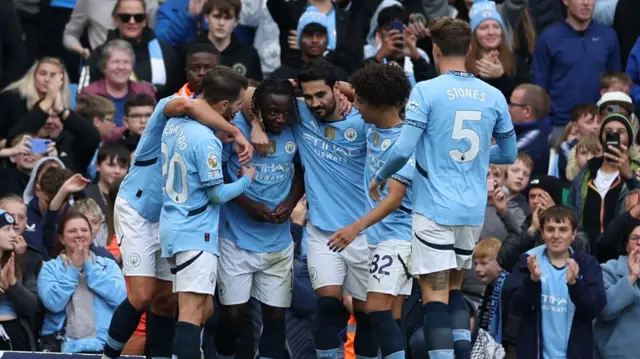 eremy Doku of Manchester City (C) celebrates scoring the 3-1 goal during the English Premier League soccer match between Manchester City and Fulham FC in Manchester, Britain, 05 October 2024.