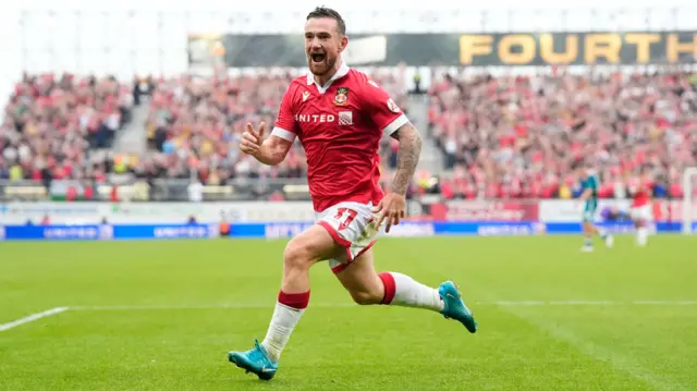 Jack Marriott celebrates scoring for Wrexham at the Racecourse