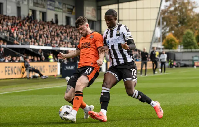 St Mirren's Roland Idowu closes down Dundee United's Will Ferry