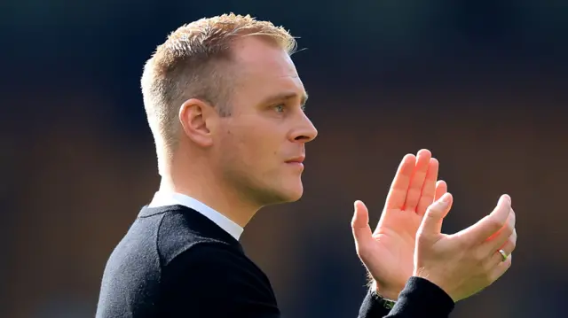 Norwich boss Johannes Hoff Thorup claps the fans