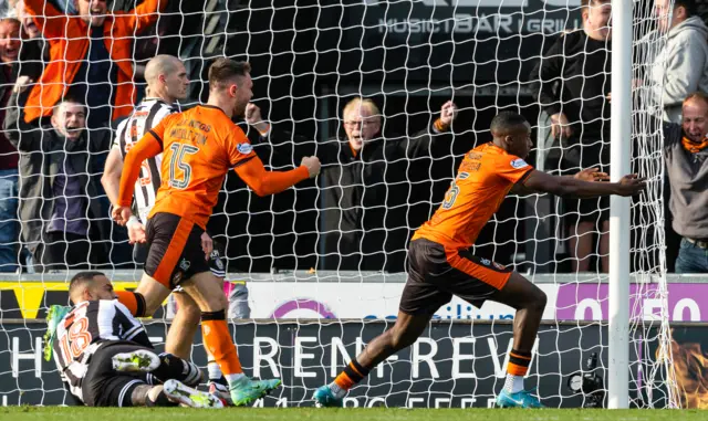 Emmanuel Adegboyega celebrates after scoring for Dundee United against Motherwell