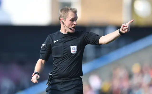 Referee Gavin Ward points