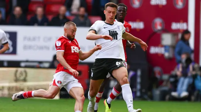 Krystian Bielik of Birmingham challenges Charlton's Allan Campbell