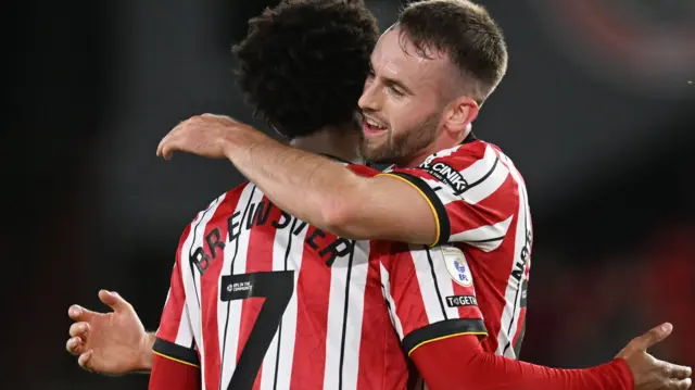 Sheffield United players hug