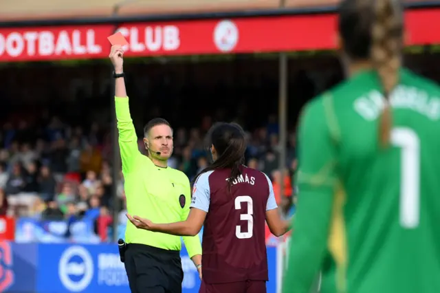 Paula Tomas is shown a red card by the referee