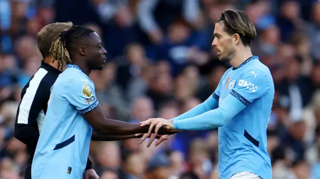 Manchester City's Jeremy Doku comes on as a substitute to replace Manchester City's Jack Grealish