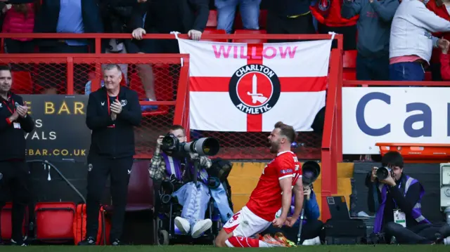 Matty Godden celebrates in front of the Charlton fans