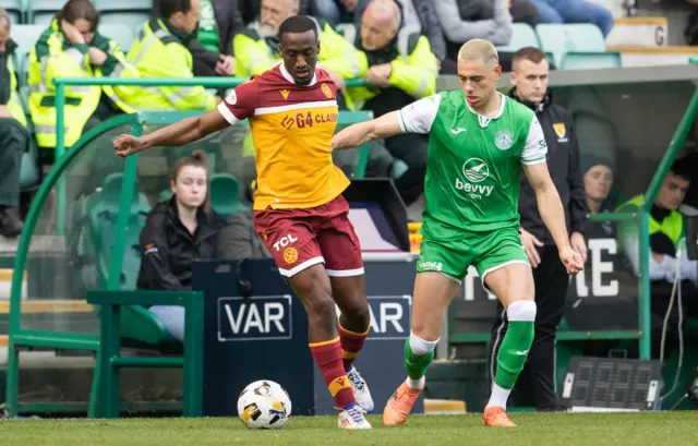 Motherwell's Zach Robinson is closed down by Hibernian's Lewis Miller