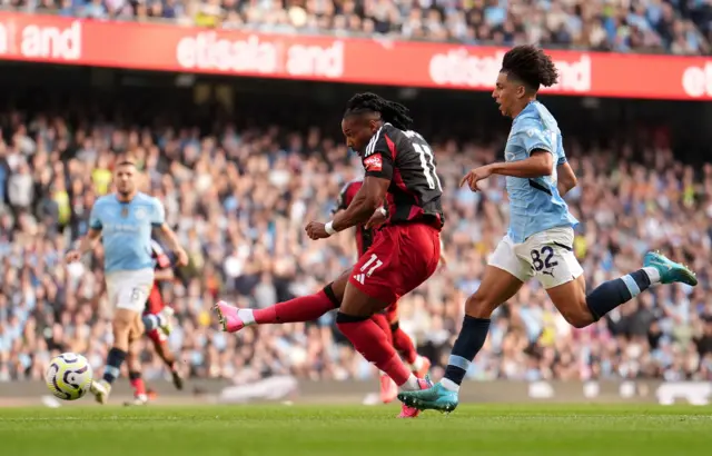 ulham's Adama Traore shoots at goal during the Premier League match at the Etihad Stadium, Manchester.