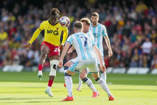 Watford's Tom Dele-Bashiru attempts to control the ball