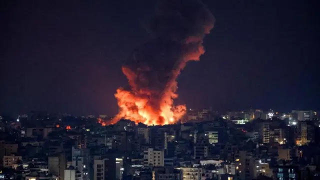 Smoke and flames rise over Beirut's southern suburbs after a strike, amid ongoing hostilities between Hezbollah and Israeli forces, as seen from Sin El Fil, Lebanon, October 6, 2024.