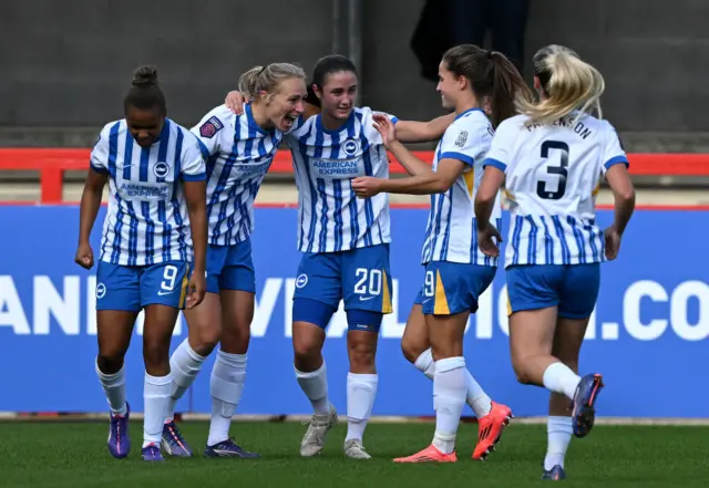 Bremer is congratulated by teammates after putting Brighton ahead