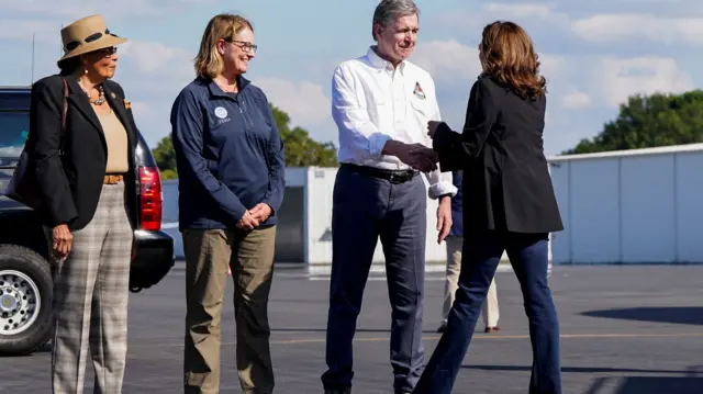 Democratic presidential nominee and U.S. Vice President Kamala Harris is welcomed by North Carolina Governor Roy Cooper