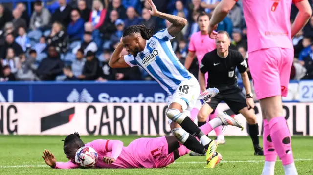 Barnsley's Fabio Jalo goes to ground inside the penalty area