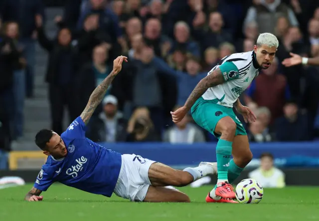 Everton's Dwight McNeil in action with Newcastle United's Bruno Guimaraes