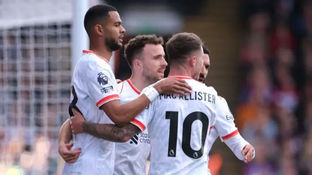 Diogo Jota of Liverpool celebrates scoring his team's first goal with teammates during the Premier League match between Crystal Palace FC and Liverpool FC at Selhurst Park on October 05, 2024 in London, England.