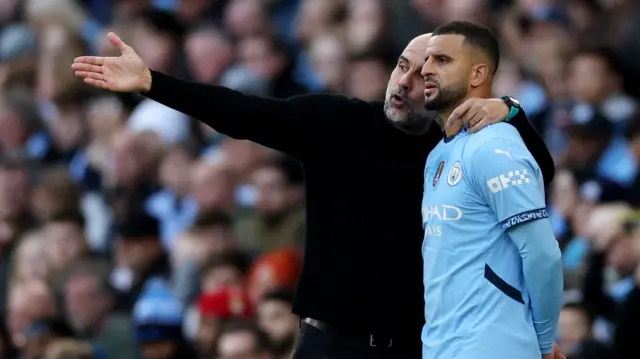 Manchester City manager Pep Guardiola gives instructions to Manchester City's Kyle Walker