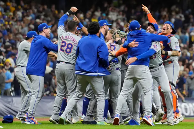 The New York Mets celebrate victory over the Milwaukee Brewers"