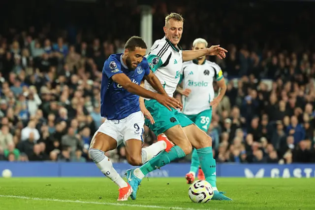 Dominic Calvert-Lewin of Everton is challenged by Dan Burn