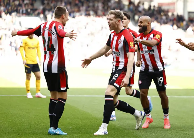 Brentford's Nathan Collins celebrates scoring their first goal with Mikkel Damsgaard and Bryan Mbeumo Action